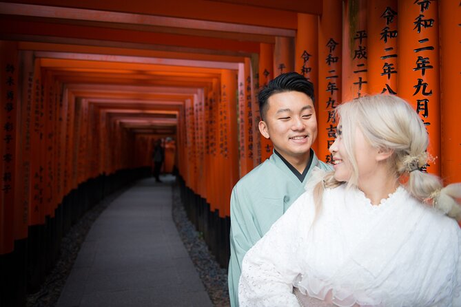 Guided Photoshoot of Fushimi Inari Shrine and Secret Bamboo Grove - First stop at the shrine entrance: foxes, gold, and red layers