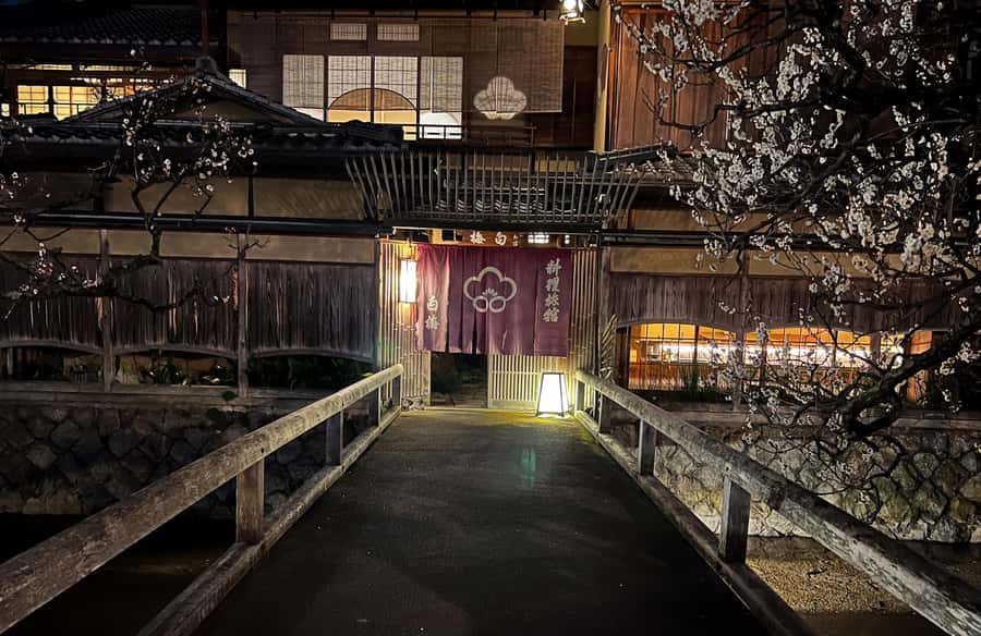 Kyoto: Gion and Geisha Walking Tour - Yasaka Shrine, lit up, with geisha and maiko stories that add context