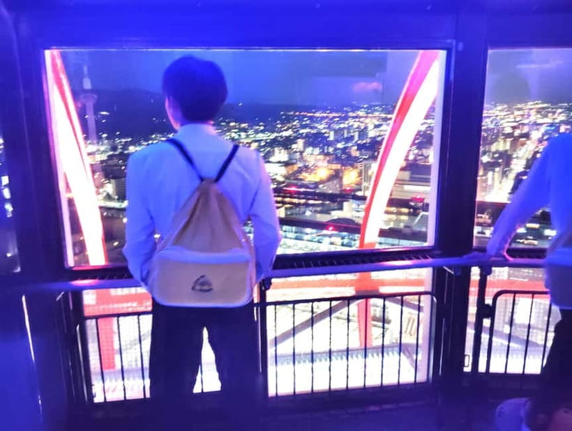 Kyoto: Station and Tower Night Tour with Light Show - Rain-friendly walking and why wet nights can look better
